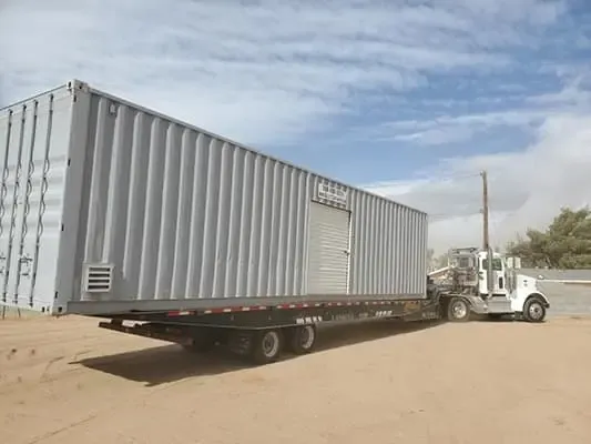 Shipping container being transported