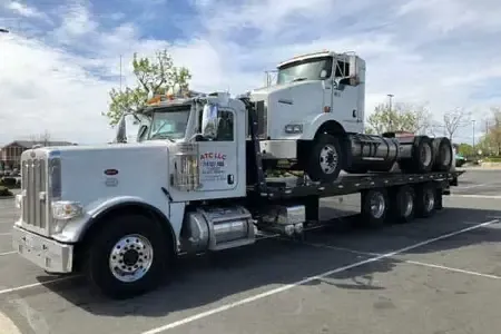 Truck hauling a shipping container