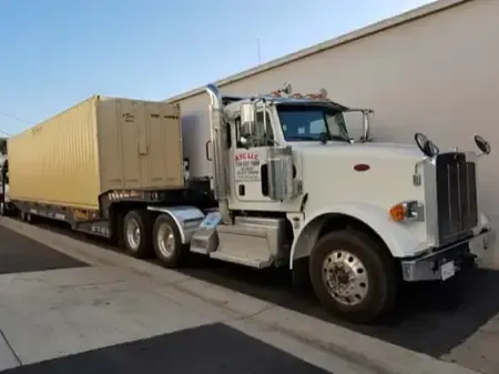 Shipping container on flatbed truck